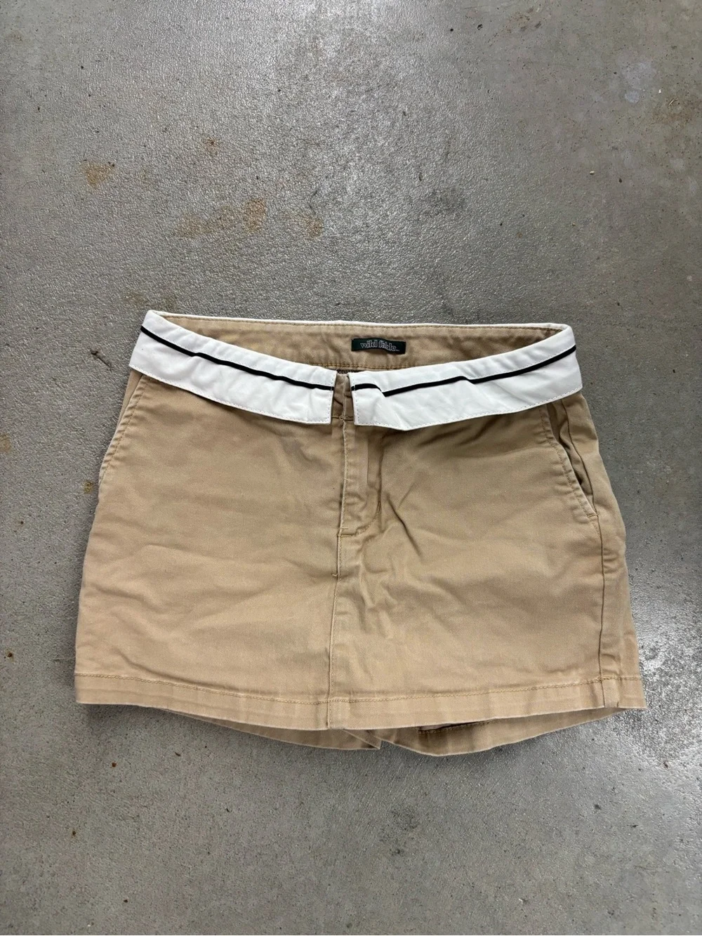 khaki skort with white trim